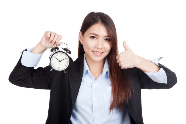 Young Asian businesswoman thumbs up with alarm clock — Stock Photo, Image