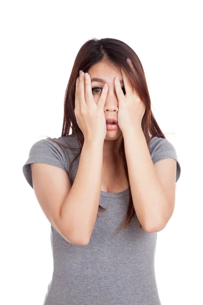 Young Asian woman  peeking though her fingers — Stock Photo, Image