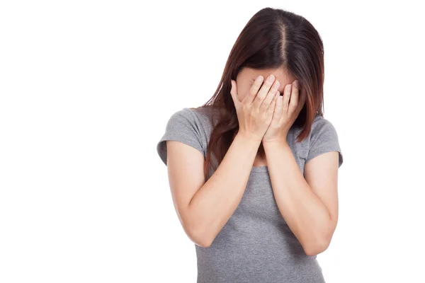 Sad young Asian woman crying with face on palm — Stock Photo, Image