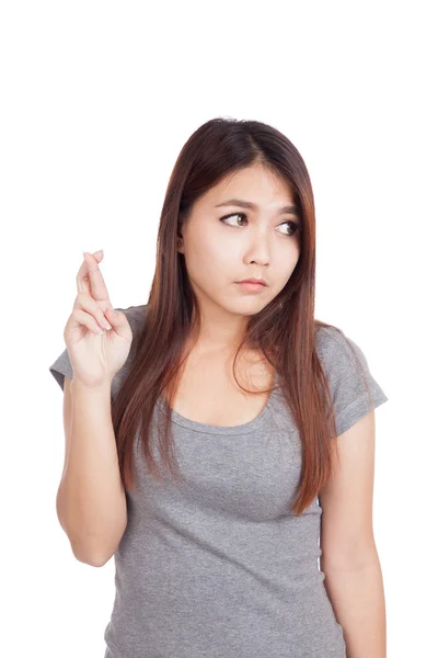 Joven asiática mujer cruz sus dedos mirar hacia otro lado — Foto de Stock