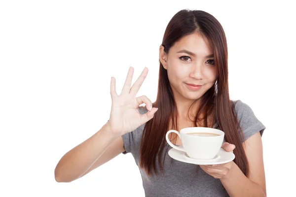 Young Asian woman with cup of coffee — Stock Photo, Image