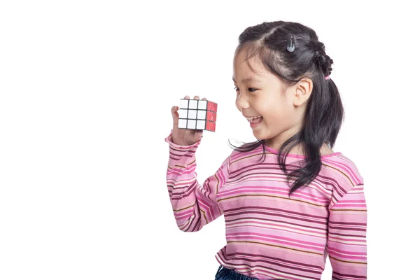 Asian clever little girl hold cube and laughing — Stock Photo, Image