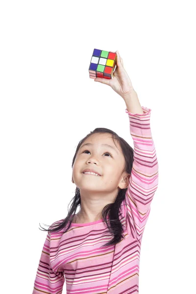Asian clever little girl hold cube and laughing — Stock Photo, Image