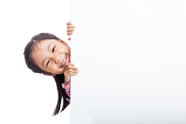 Asian little girl peeking behind empty billboard