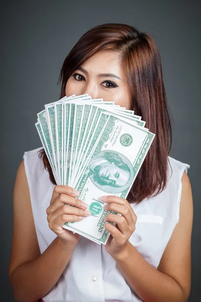 Beautiful Asian girl hold over size 100 dollar bills — Stock Photo, Image