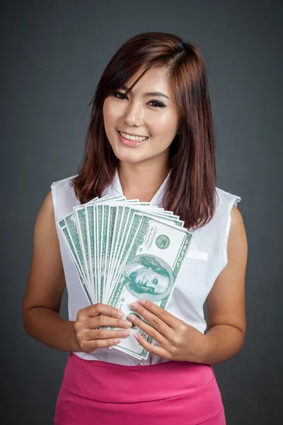 Beautiful Asian girl with many100 dollar bills — Stock Photo, Image