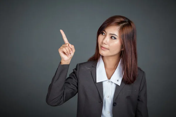 Asian business woman point to her left — Stock Photo, Image