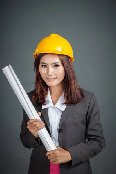 Asian engineer girl hold a blueprint and smile — Stock Photo, Image