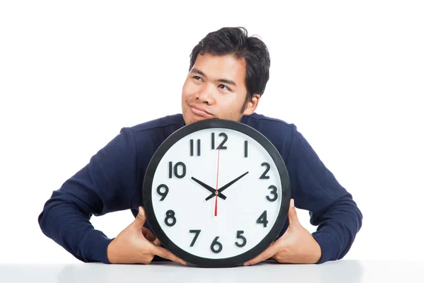 Asian man bored with a clock — Stock Photo, Image