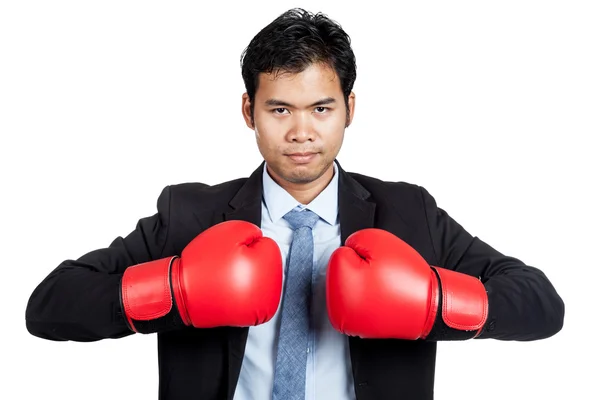 Asiatischer Geschäftsmann mit rotem Boxhandschuh — Stockfoto