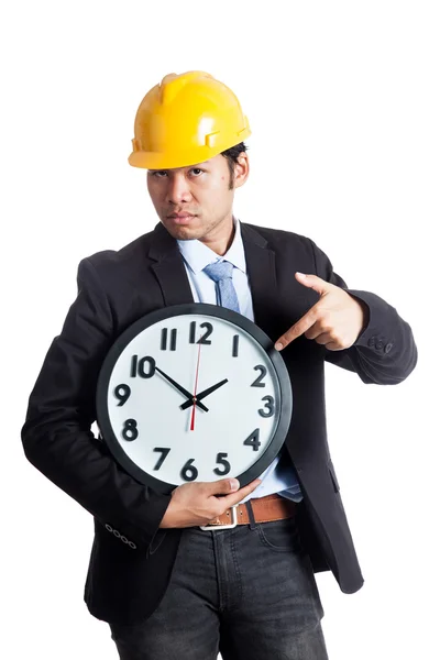 Asian engineer man point to a clock — Stock Photo, Image