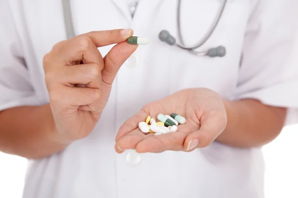 Doctor pick a capsule from palm hand — Stock Photo, Image