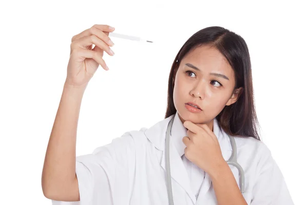 Young Asian female doctor  think with thermometer — Stock Photo, Image