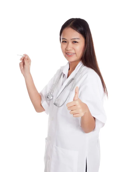 Young Asian female doctor thumbs up  with thermometer — Stock Photo, Image