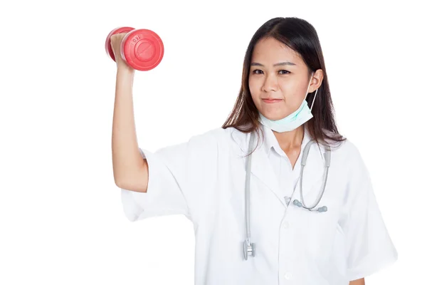 Young Asian female doctor with dumbbell — Stock Photo, Image