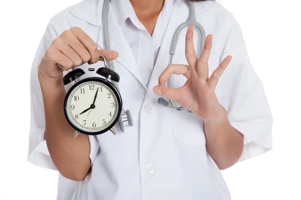 Close up Asian doctor show OK with a clock — Stock Photo, Image