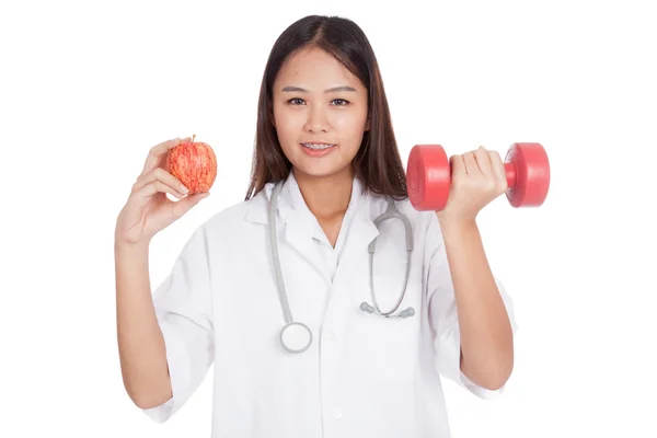 Young Asian female doctor  hold apple and dumbbell — Stock Photo, Image