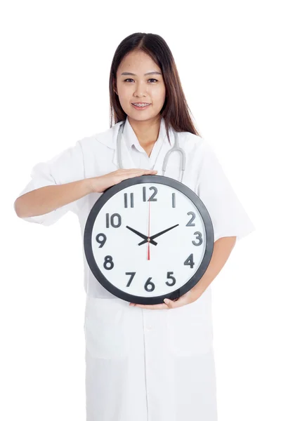 Young Asian female doctor happy show a clock — Stock Photo, Image