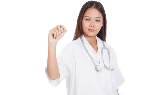 Young Asian female doctor write with a red marker — Stock Photo, Image