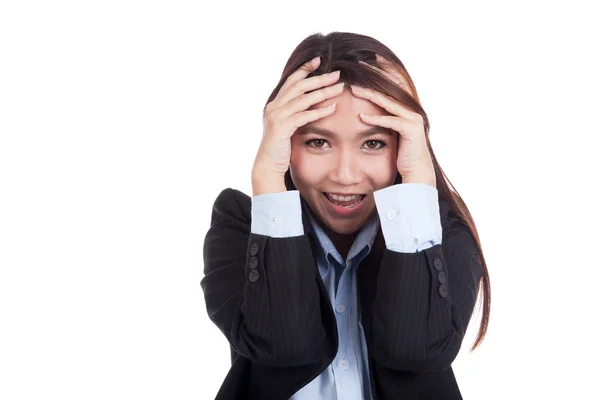 Happy young Asian businesswoman with hand on her head — Stock Photo, Image