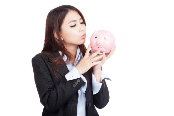 Young Asian businesswoman kiss piggy bank — Stock Photo, Image