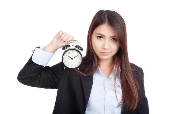 Young Asian businesswoman with alarm clock — Stock Photo, Image