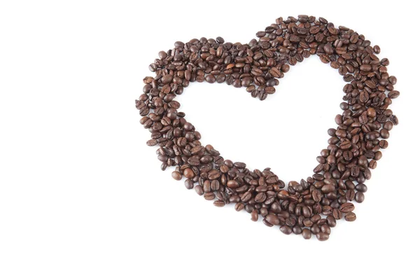 Roasted coffee beans in heart shape — Stock Photo, Image