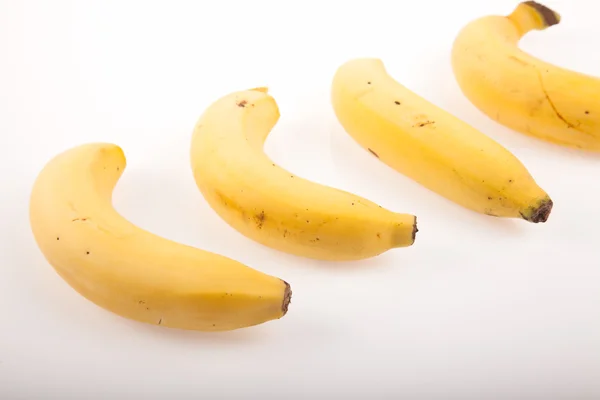 Four  yellow ripe bananas — Stock Photo, Image