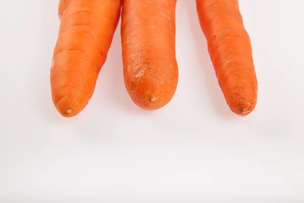 Three carrots on white background — Stock Photo, Image