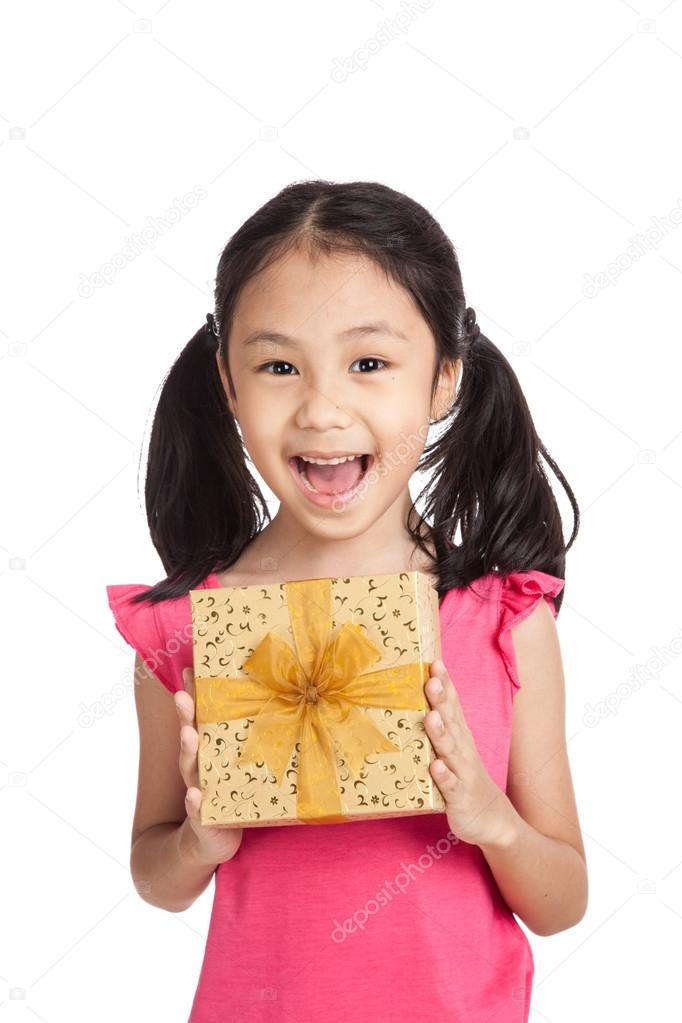 Little asian girl with gift box