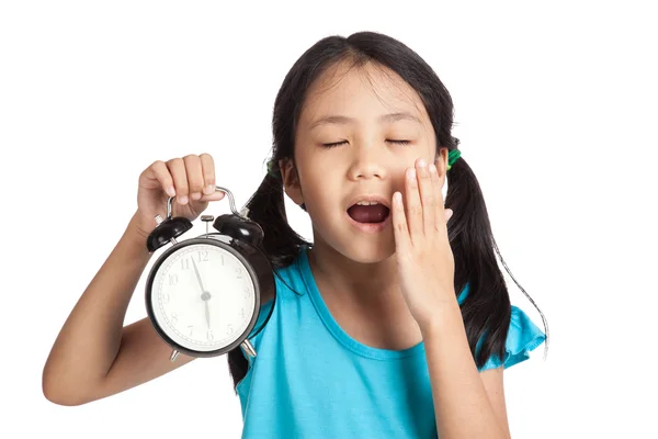 Little asian girl sleepy with a clock — Stock Photo, Image