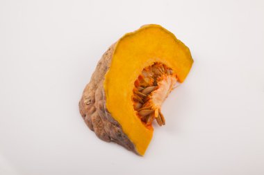 Cutted ripe orange pumpkin on white background