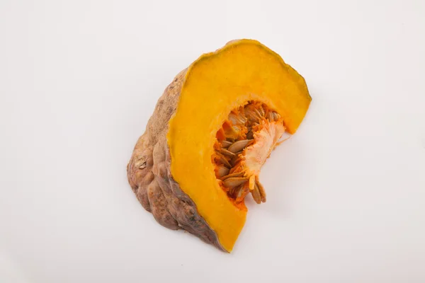 Cutted ripe orange pumpkin on white background — Stok fotoğraf