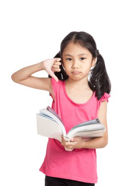 Little asian girl unhappy show thumbs down  read a book