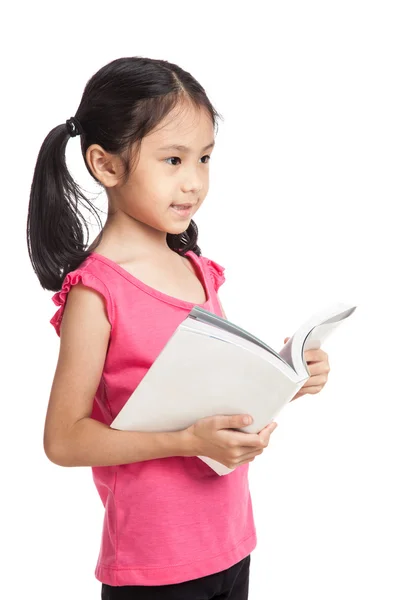 Happy little asian girl  read a book — Zdjęcie stockowe
