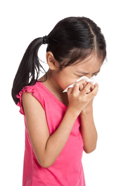 Little asian girl sneeze with napkin paper — Stockfoto