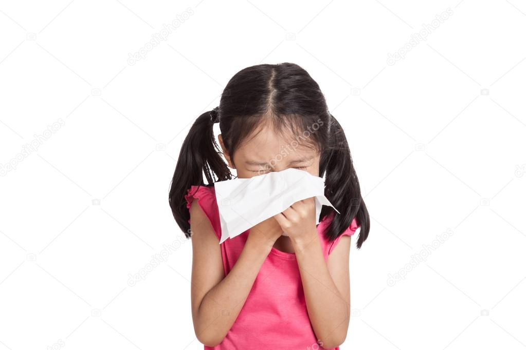 Little asian girl sneeze with napkin paper