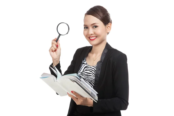 Asian business woman with a book and magnifying glass — Stock Photo, Image