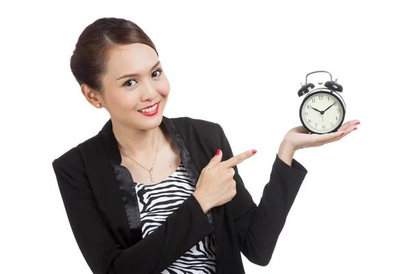 Young Asian business woman point to a clock — Stock Photo, Image