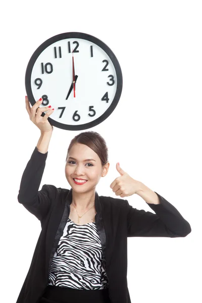 Young Asian business woman thumbs up with a clock — Stock Photo, Image