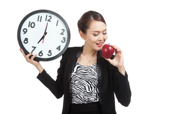 Kobieta młody azjatycki biznes czerwony jabłko i zegar — Zdjęcie stockowe