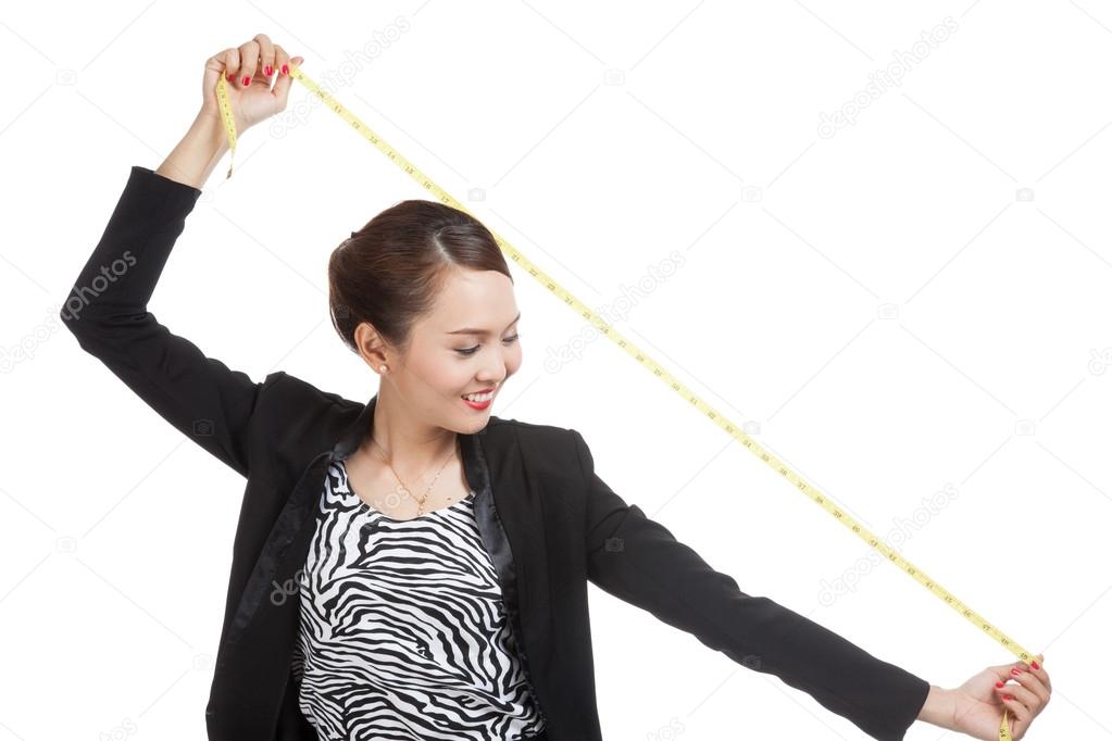 Young Asian business woman with measuring tape