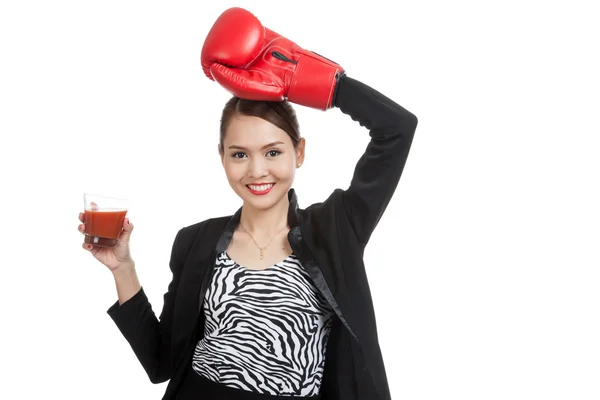 Young Asian business woman with tomato juice and boxing glove — Stock Photo, Image