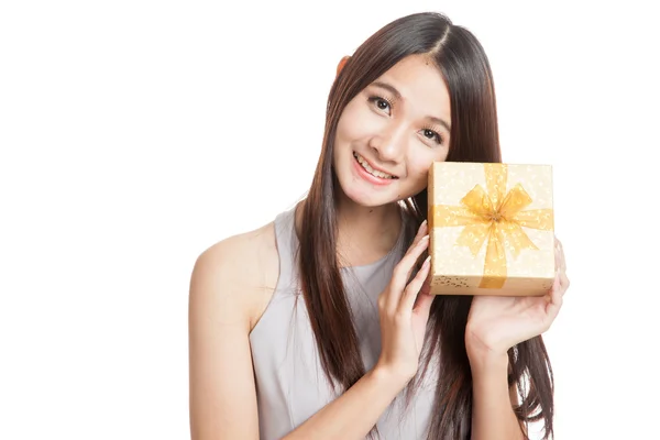 Beautiful young Asian woman with golden gift box — Stock Photo, Image