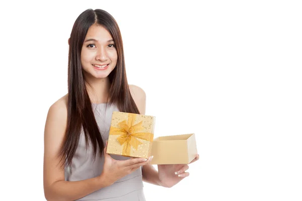 Beautiful young Asian woman with golden gift box — Stock Photo, Image