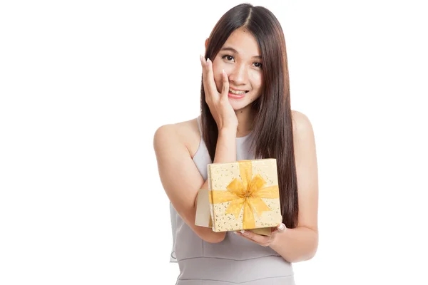 Excited beautiful young Asian woman with golden gift box — Stock Photo, Image