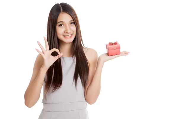 Beautiful young Asian woman with red gift box — Stock Photo, Image