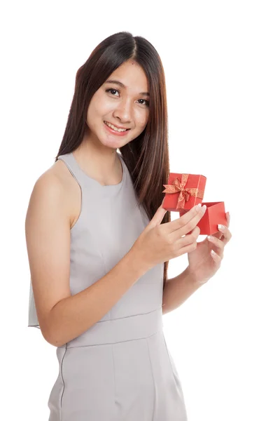 Beautiful young Asian woman with red gift box — Stock Photo, Image