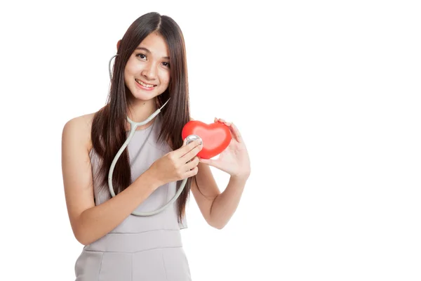Beautiful young Asian woman with red heart and stethoscope — Stock Photo, Image