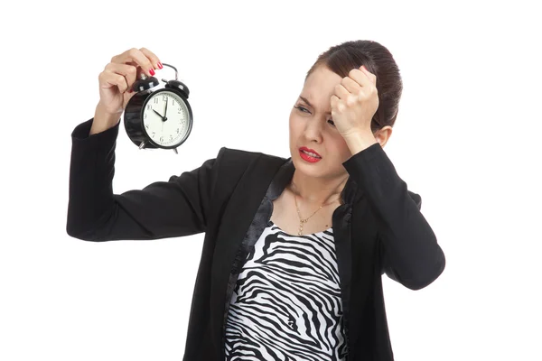 Young Asian business woman is  stressed with a clock — Stock Photo, Image